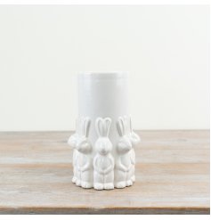 Elegant Easter vase featuring standing rabbits and a smooth white glazed surface, perfect for spring decor.