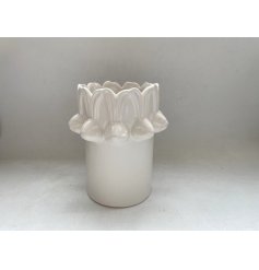 Welcome spring with this stylish white vase featuring a charming repeating bunny head design.