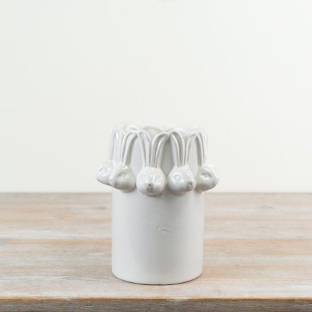 Step into Spring with this chic glazed vase in white with a repeat bunny head pattern