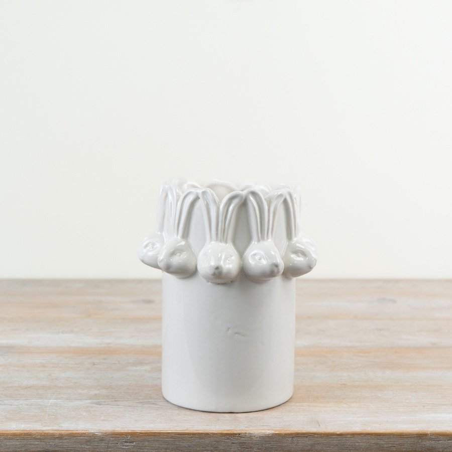 Welcome spring with this stylish white glazed vase, featuring a charming repeating bunny head design.