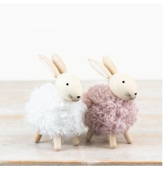 A mix of 3 neutral wool rabbits, each standing with adorable white pom-pom tails.