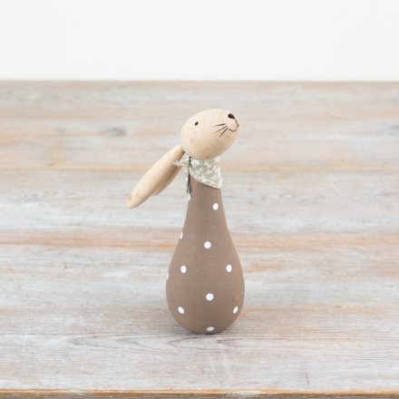 Wooden bunny with brown polkadot pattern, perfect for adding a touch of spring to your display.