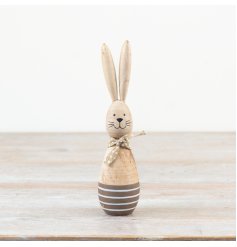 This adorable wooden bunny sports a trendy polkadot scarf. Perfect for adding a whimsical touch to your decor.