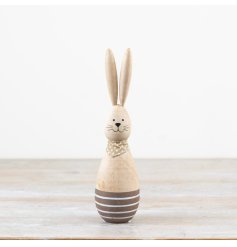 This adorable wooden bunny sports a trendy polkadot scarf. Perfect for adding a whimsical touch to your decor.