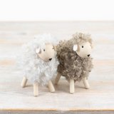 White and natural woolly sheep ornaments. A charming seasonal gift item and interior accessory.