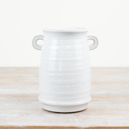 A chic vase with a white glaze and small eared handles. A unique, hand crafted item with character and charm. 