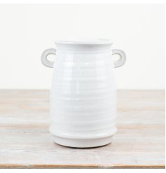 A chic vase with a white glaze and small eared handles. A unique, hand crafted item with character and charm. 