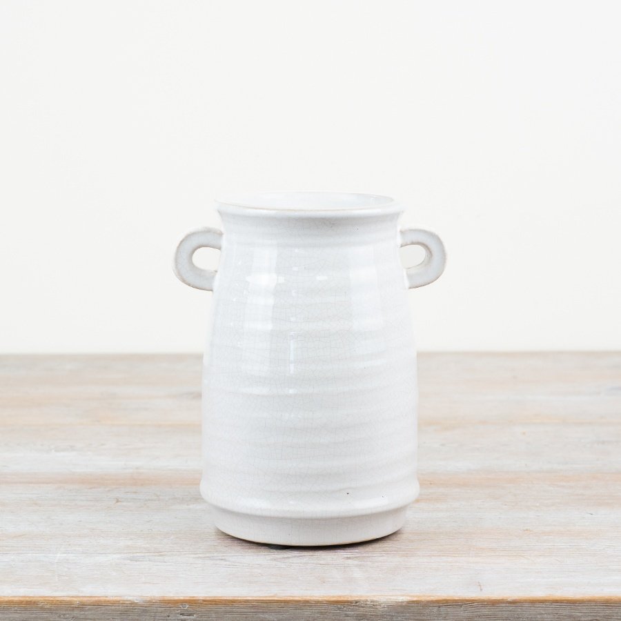 A timeless vase with small eared handles. A hand finished product with a subtle white crackled glaze.