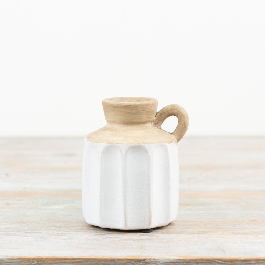Sleek ceramic pitcher adds elegance to any table setting. 