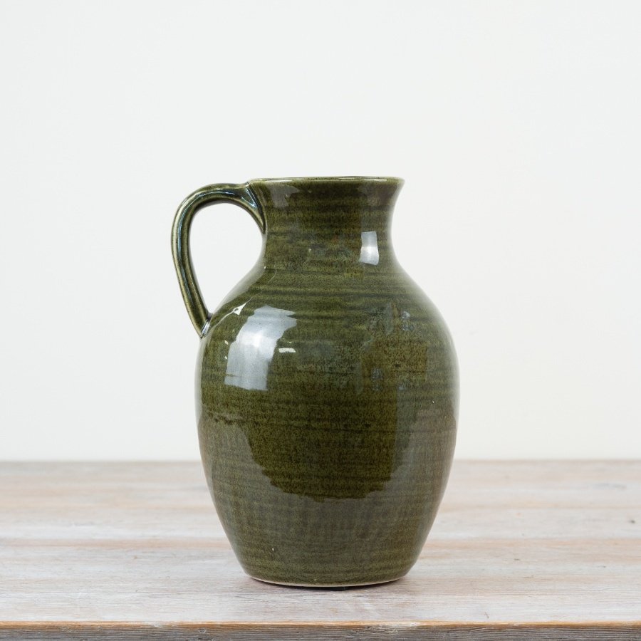 Stunning green-glazed pitcher vase - an elegant addition to any space.