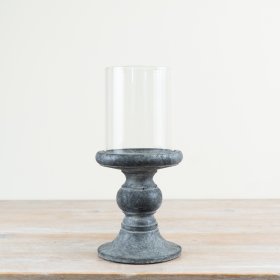 Enhance your decor with this chic cement hurricane candle holder.