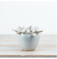 Adorable planter featuring a delightful bird motif.