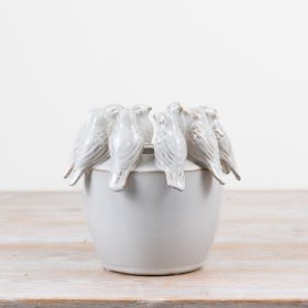 Adorable planter featuring a cute birdie motif