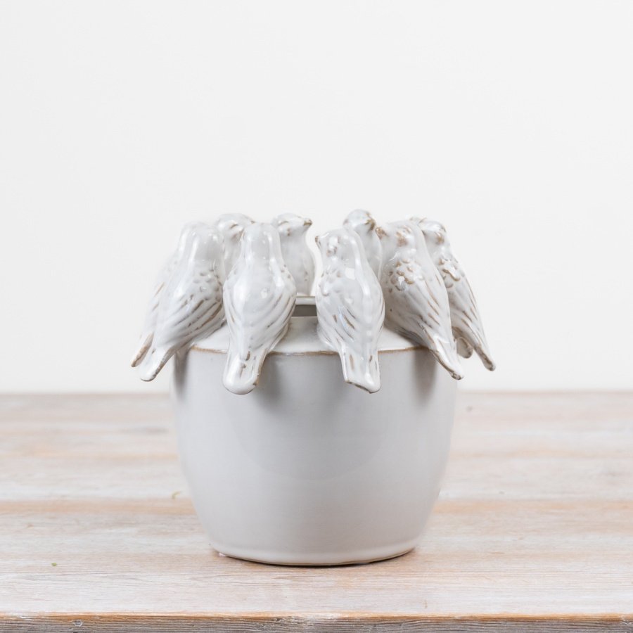 Adorable planter featuring a cute birdie motif
