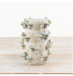 Delightful three-dimensional vase with unique charm and style.