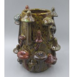 Bring nature indoors with this charming mushroom glazed vase.