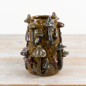 Bring nature indoors with this beautifully glazed mushroom vase.