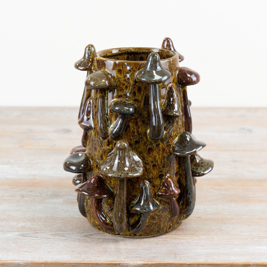 Bring nature indoors with this beautifully glazed mushroom vase.