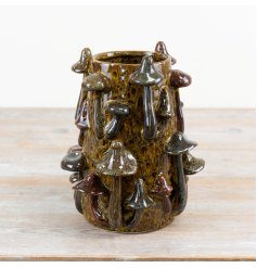 Bring nature indoors with this charming mushroom glazed vase.
