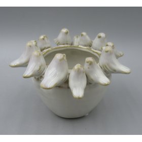 Adorable planter featuring a delightful bird motif.