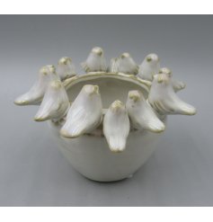 Adorable planter featuring a delightful bird motif.