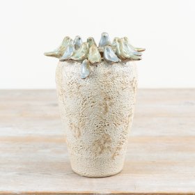 Enhance your home decor with this stone vase featuring charming glazed birds. A must-have for any room.