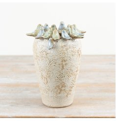 Bring nature indoors with this glazed bird-adorned stone vase - a must-have for any room in your home.