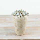 Adorned with glazed birds around the top, this stone vase is a must have for any room in the home. 