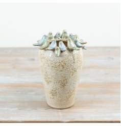 Adorned with glazed birds around the top, this stone vase is a must have for any room in the home. 