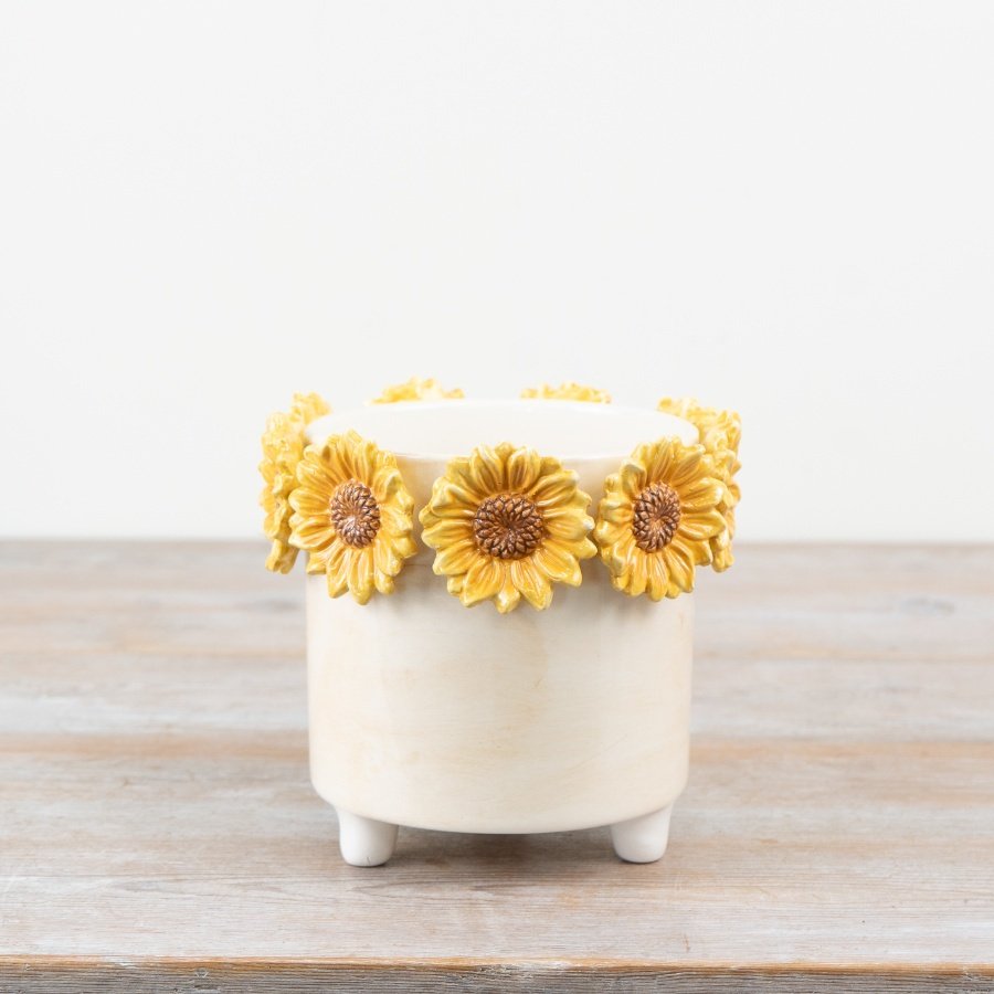 Add some sunshine to your space with our stunning sunflower planter.