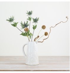 Beautifully crafted jug with elegant embossed design.