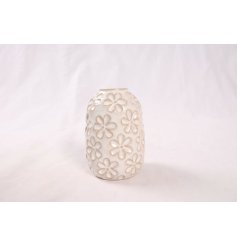 a shabby chic vase with glazed flower pattern 