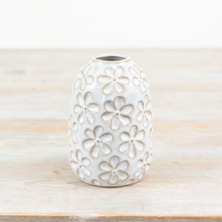 a shabby chic vase with glazed flower pattern 