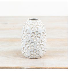 Add vintage charm to your decor with a glazed vase featuring a floral design 