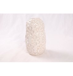 Add charm to your decor with a whimsical porcelain vase featuring a delightful daisy design.