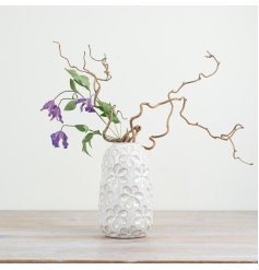 Add charm to your decor with a whimsical porcelain vase featuring a delightful daisy design.