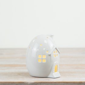 A must have seasonal decoration. A charming cottage style egg house with decorative details and warm glow LED lights.