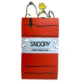 Flip, jot, and smile with the lovable Peanuts Snoopy & Woodstock Memo Pad - perfect for on-the-go notes!"