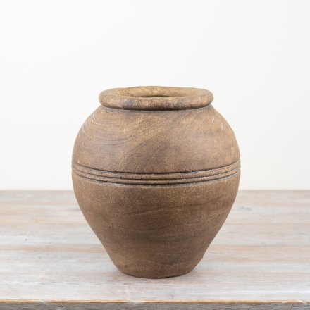 a rustic large urn shaped planter 