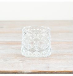 Illuminate your space with a touch of elegance with our Patterned Glass Candle Holder