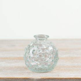 Add a touch of elegance with this chic and intricately designed clear glass bud vase.