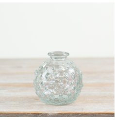A stylish clear glass patterned bud vase 