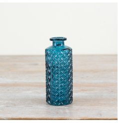 Elegant blue vase with a beautiful patterned design.