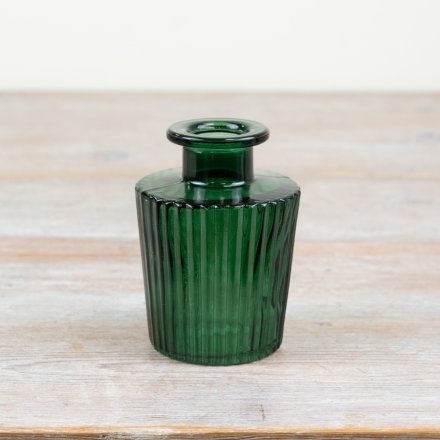 Adorn your space with a gorgeous ribbed vase in striking green colour 