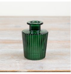Adorn your space with a gorgeous ribbed vase in striking green colour 