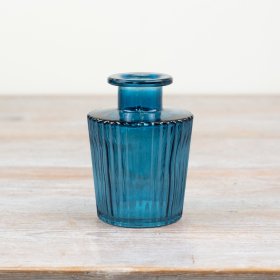 a beautiful blue ribbed bud vase 