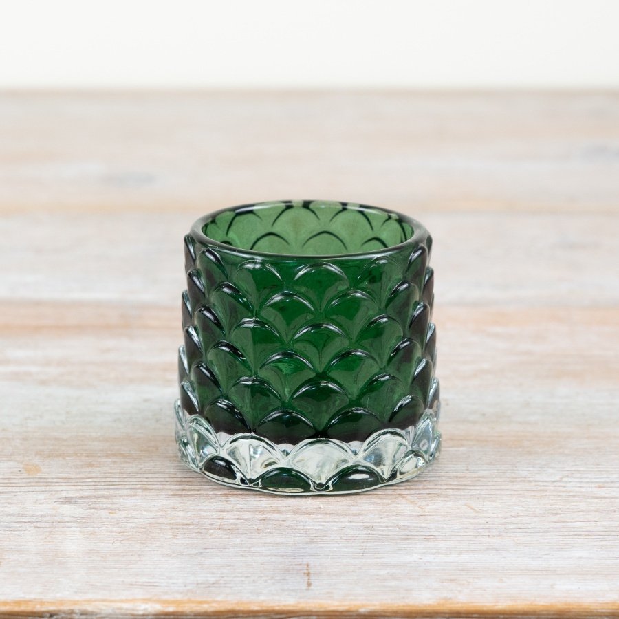 Enhance your space with elegance using our Green Glass Candle Holder - a charming addition to any decor.