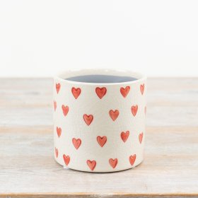 Stunning stoneware planter with glazed finish and heart design in natural shade - a perfect addition to any space!