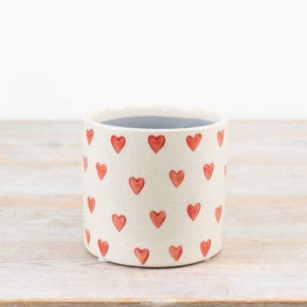 A gorgeous planter made from stoneware in a glazed natural colour tone with a rich heart pattern. 