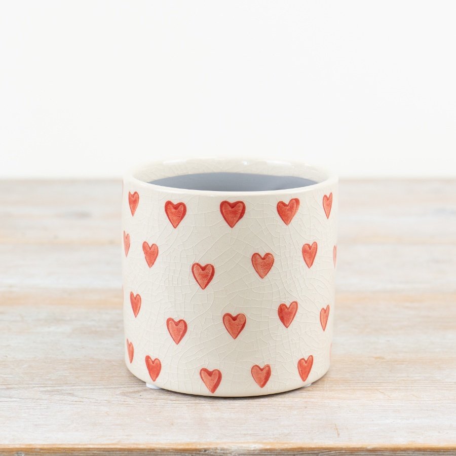 Stunning stoneware planter with glazed finish and heart design in natural shade - a perfect addition to any space!